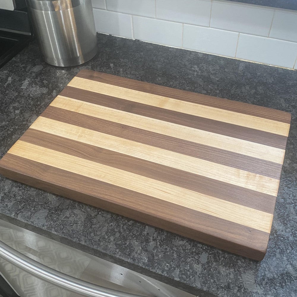 https://www.tennesseewoodworks.com/cdn/shop/products/WalnutandMapleCuttingBoard041000x1000_1024x1024.jpg?v=1659017853